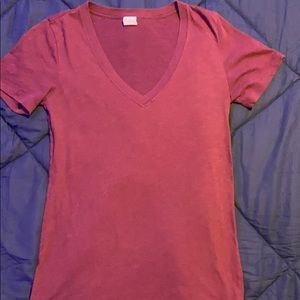 Burgundy colored v-neck shirt